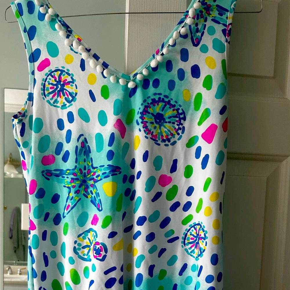 Boutique dress. Is is beautiful popping colors. My hips look to big in it.